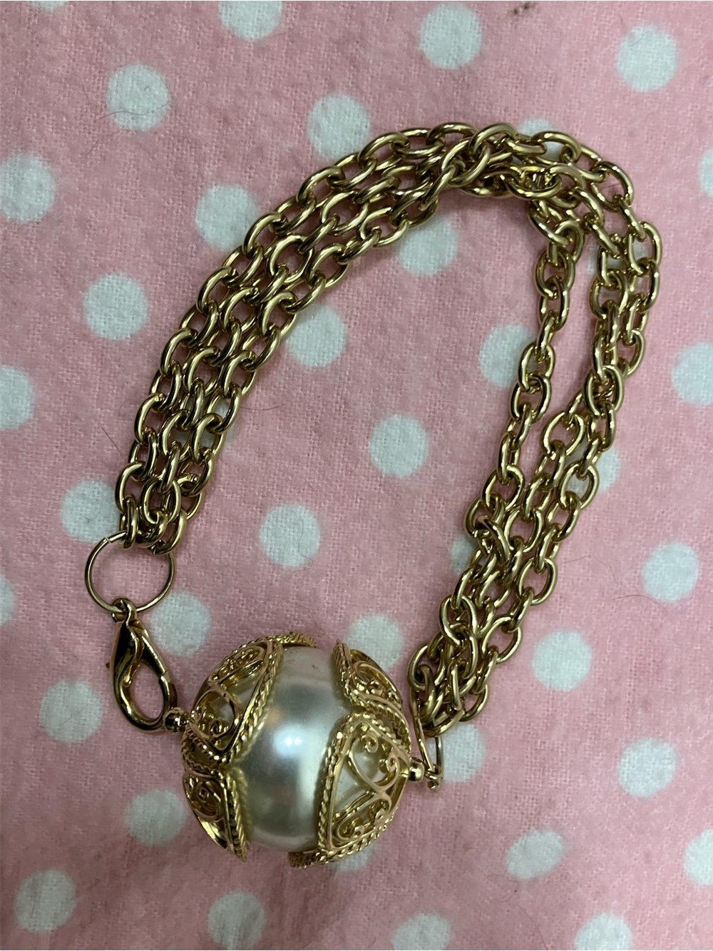 Vintage gold chain bracelet w/ large faux pearl pendant with filigree cage work.